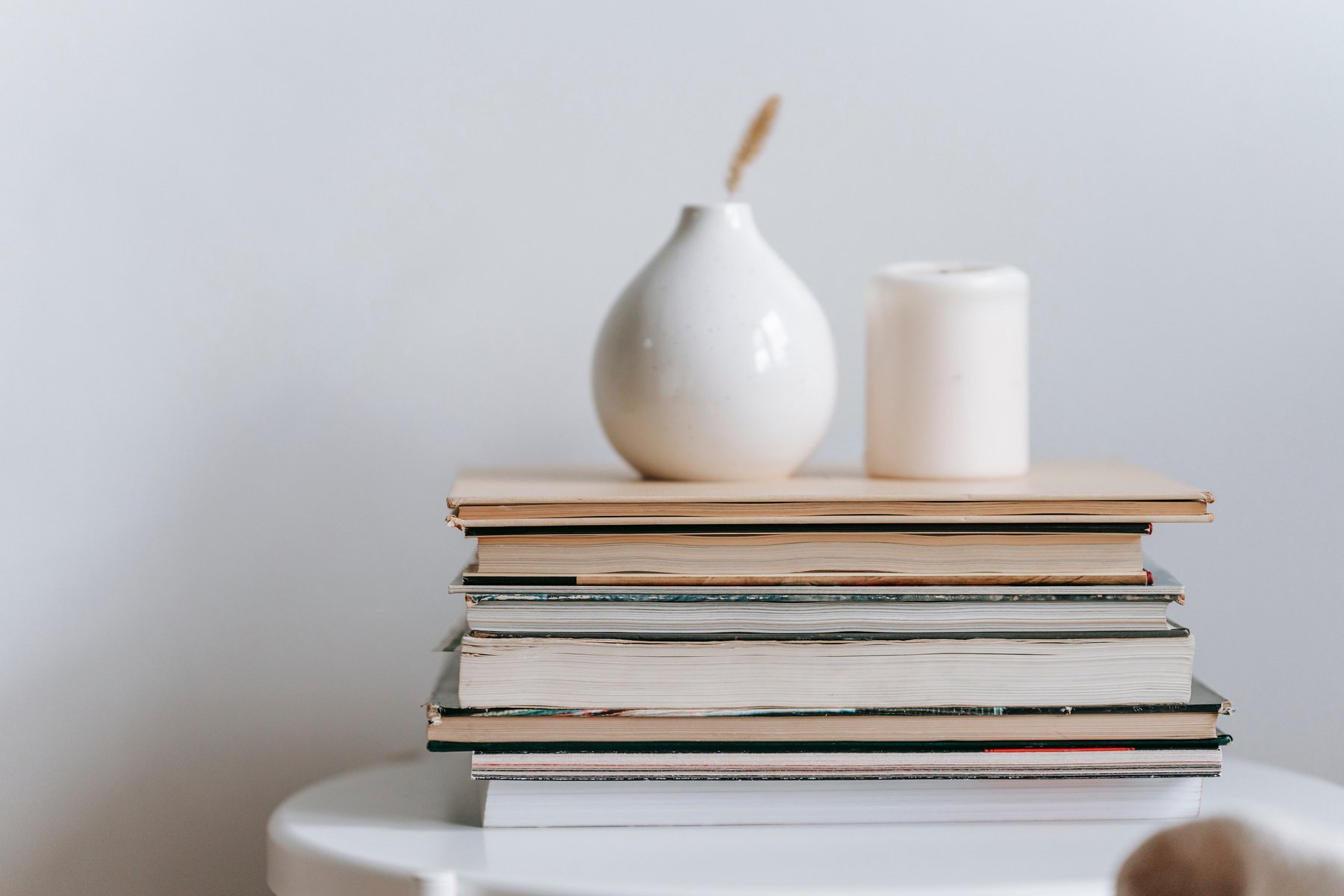 Ceramic Vases Placed on Stack of Books